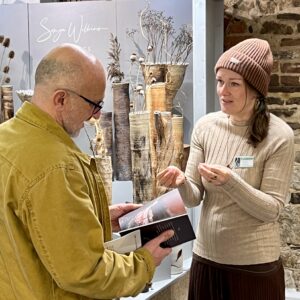 Sonya Wilkins discussing commission requirements with an interior designer for ceramic sculptures for specific installation curations