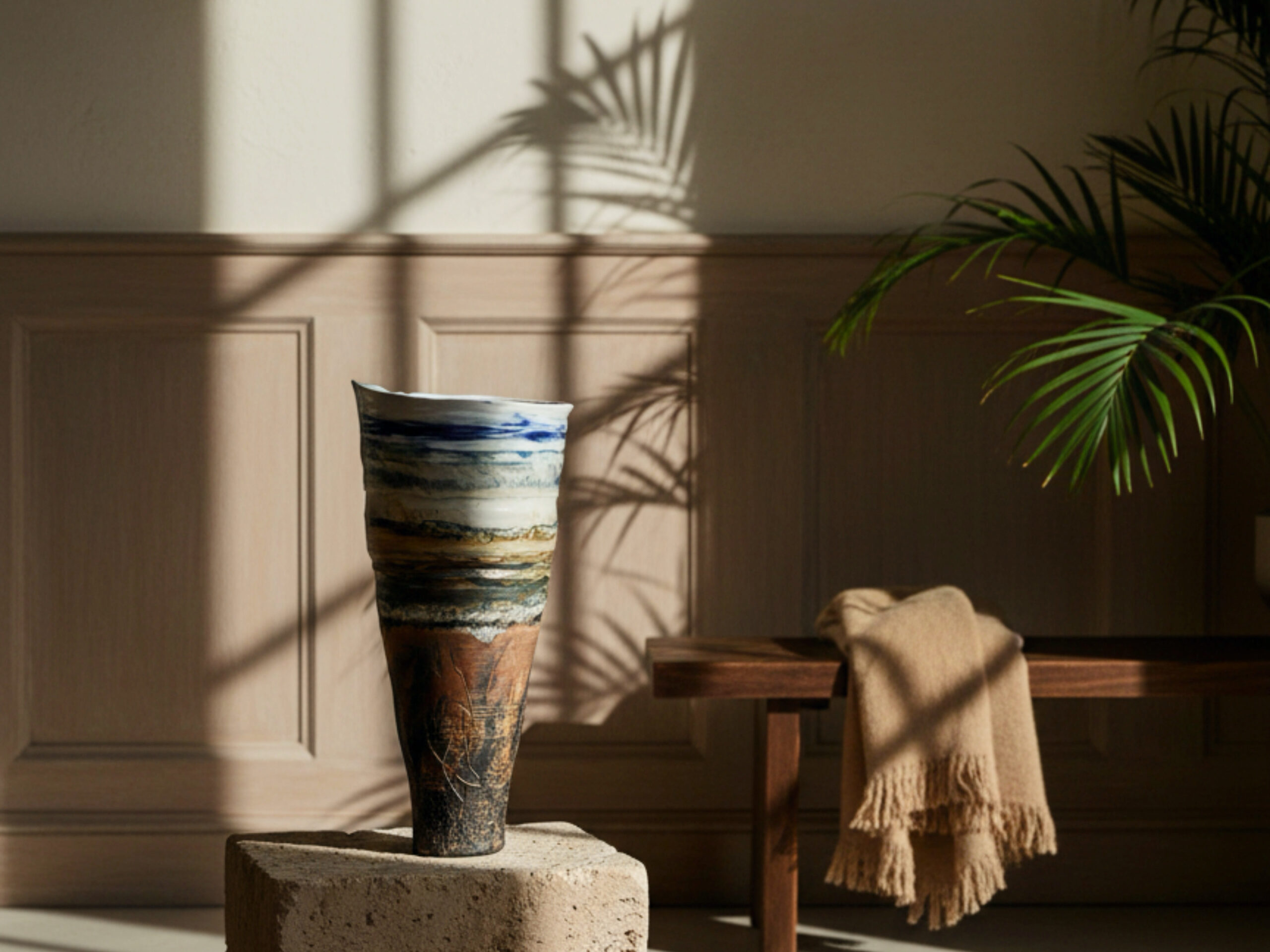 Ceramic vessel showing layers of colour depicting landscape in a contemporary living space